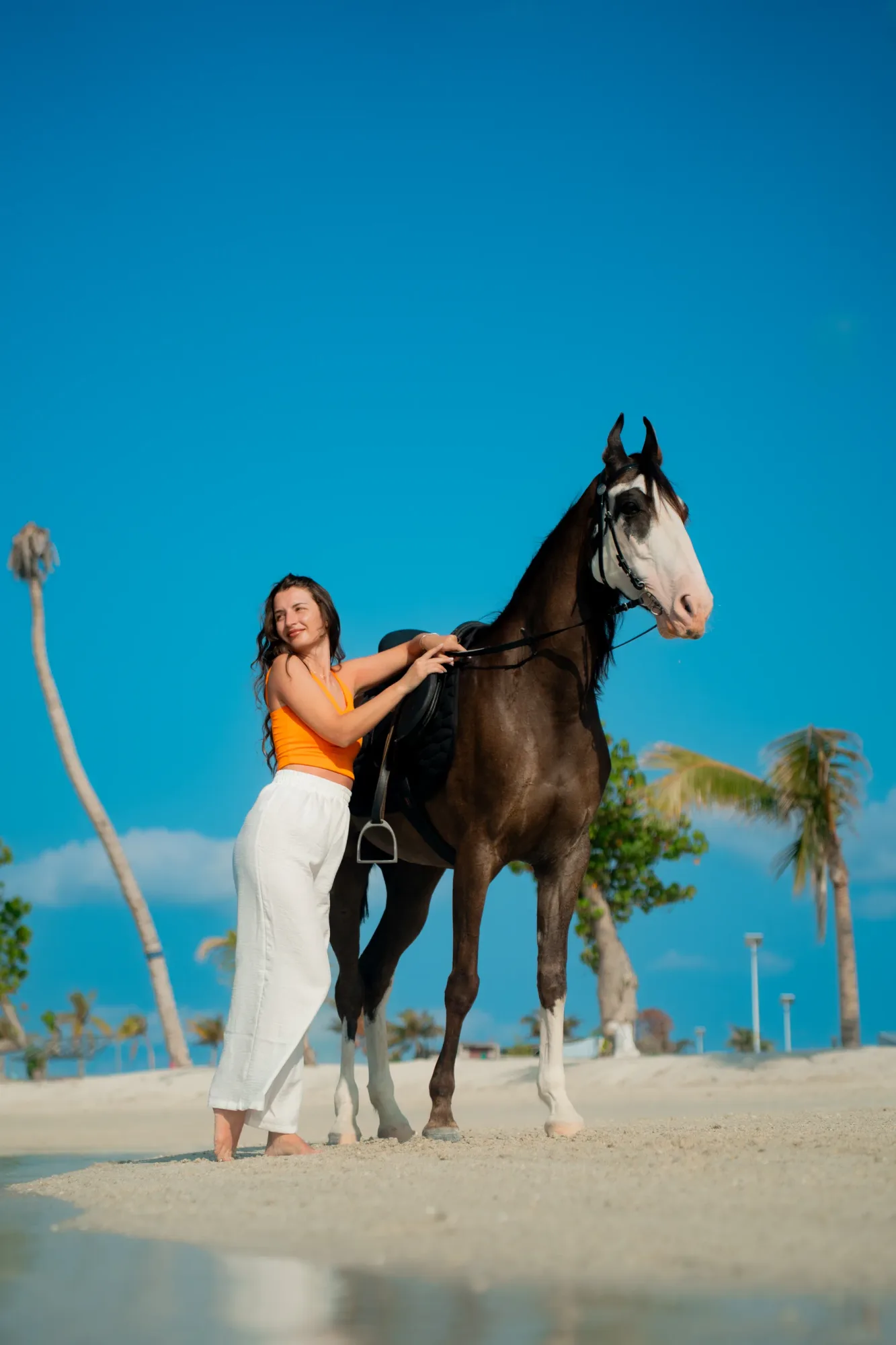 Guest riding along the lagoon at Island Stables